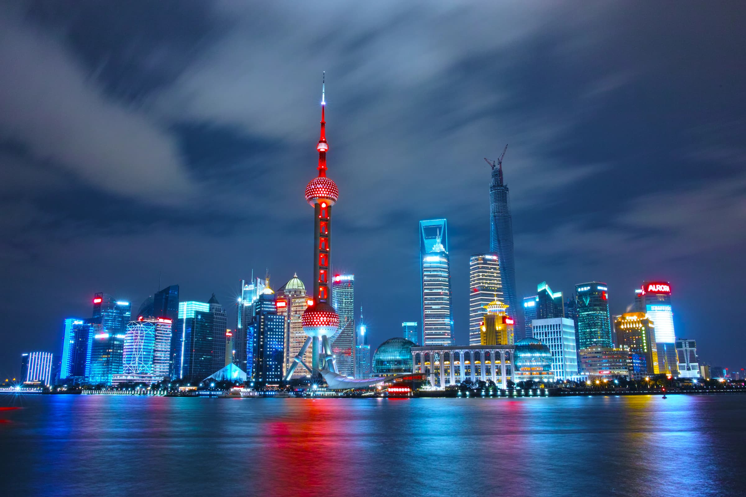 Capital corridor from China to Dubai — dual city skyline at dusk